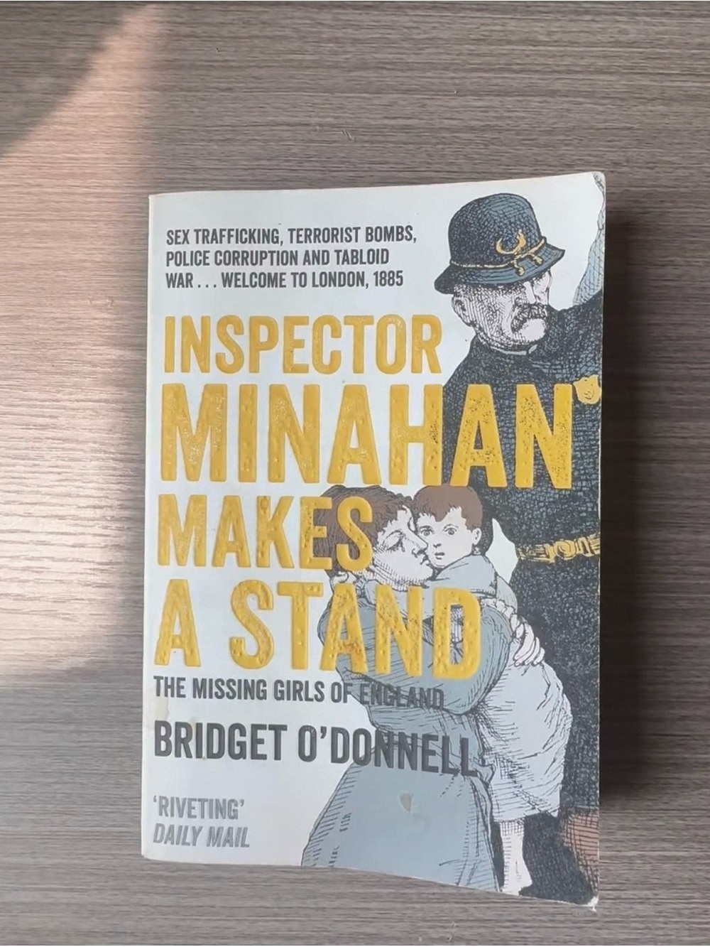 Inspector Minahan Makes a Stand — Yellow & White Cover Coffee Table Book
